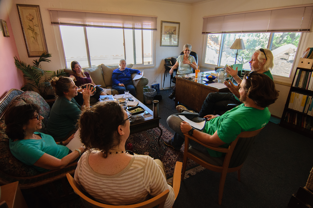 Teachers meet in the school director's office at Living Wisdom School of Palo Alto