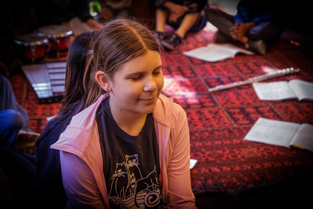 Girl circa 10 yrs old meditating