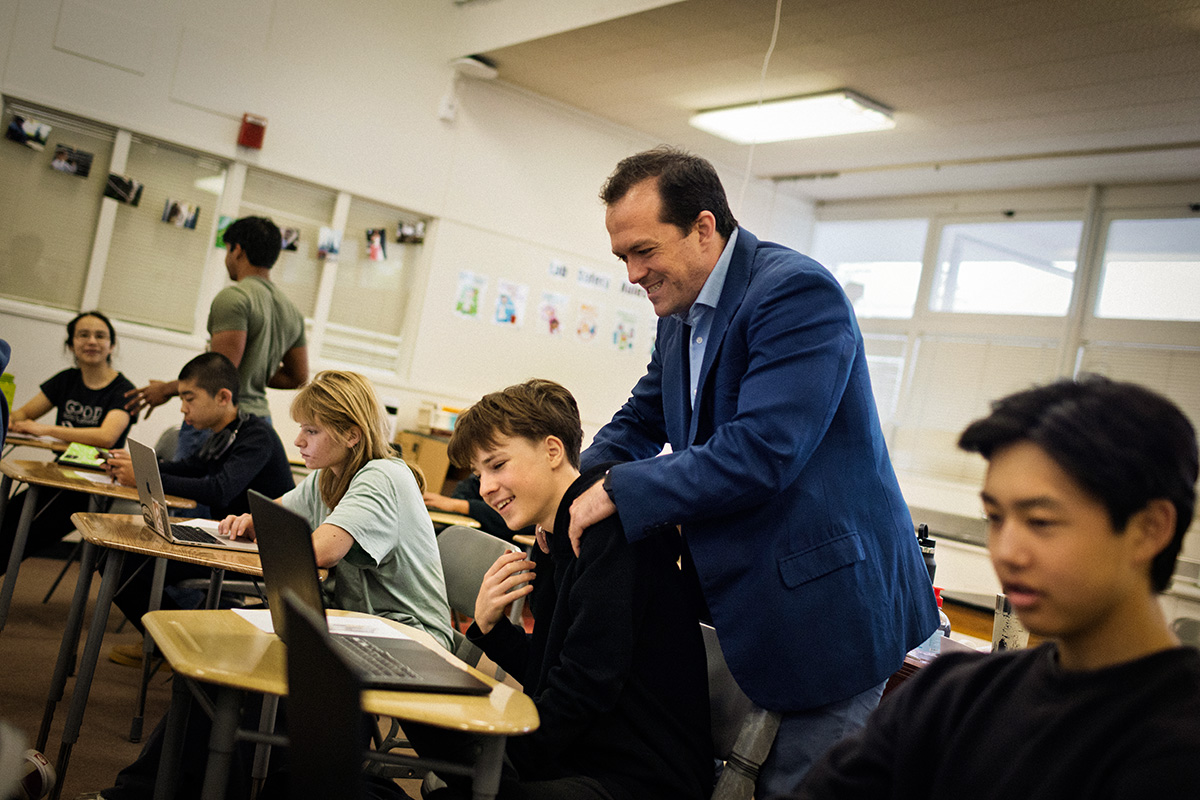 Keshava jokes with a student to help ease the tension of finals week at Living Wisdom High School in Palo Alto, CA. Photo by the author.