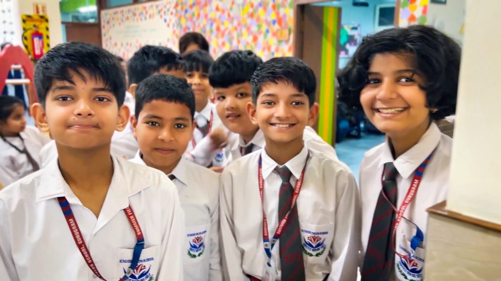 Students pose for an informal photo at a DLF Foundation sponsored school in Gurugram, India